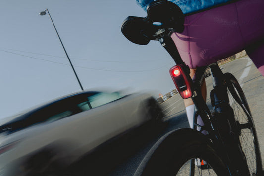 Rearview radar on bike with a passing car
