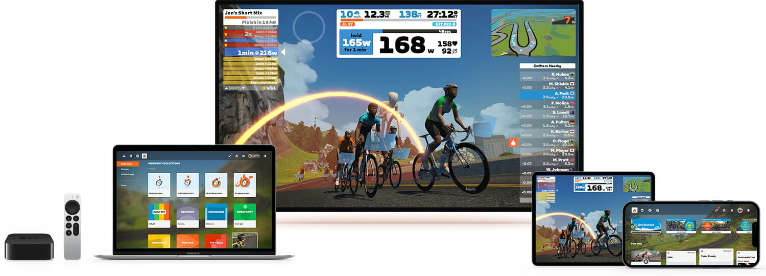 Multiple devices displaying the cycling app Zwift's interface with a focus on a large screen.